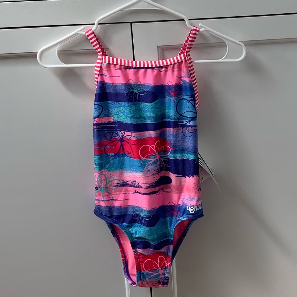 Girls’ 12 Dolfin Uglies one piece NWT and liner